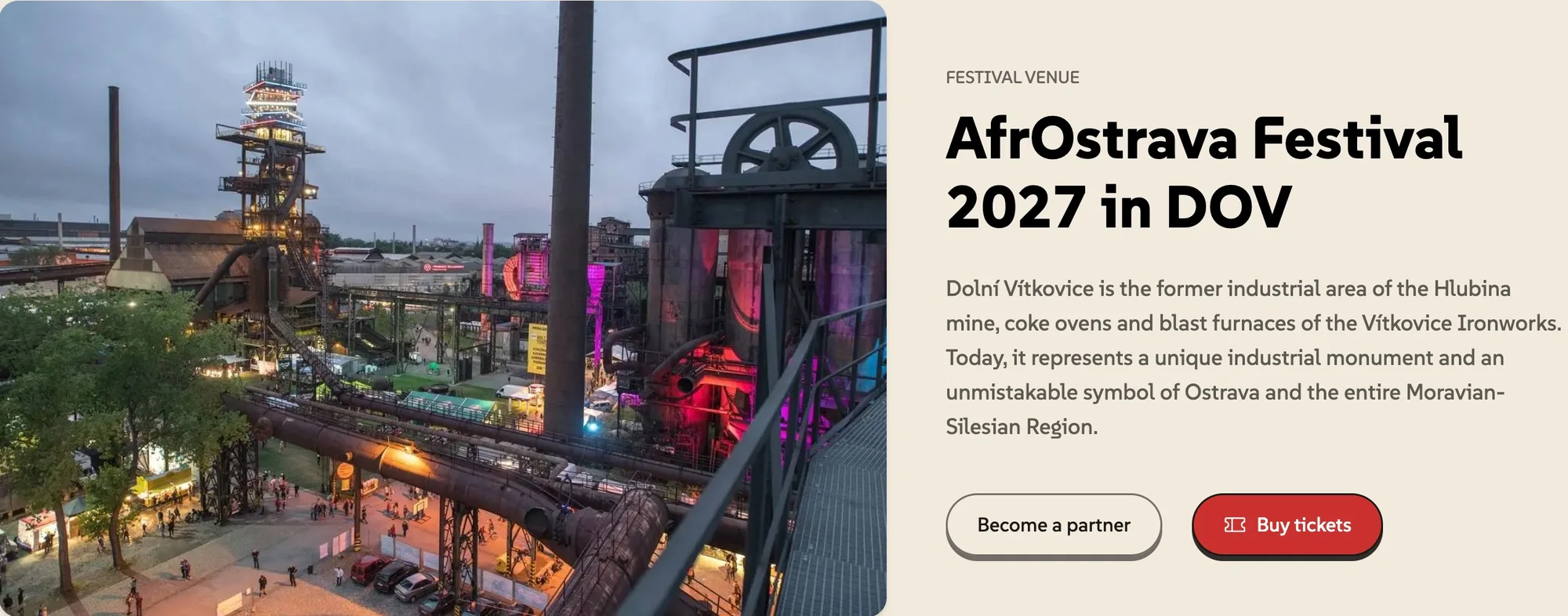 The Dolní Vítkovice ironworks at dusk beside the venue text